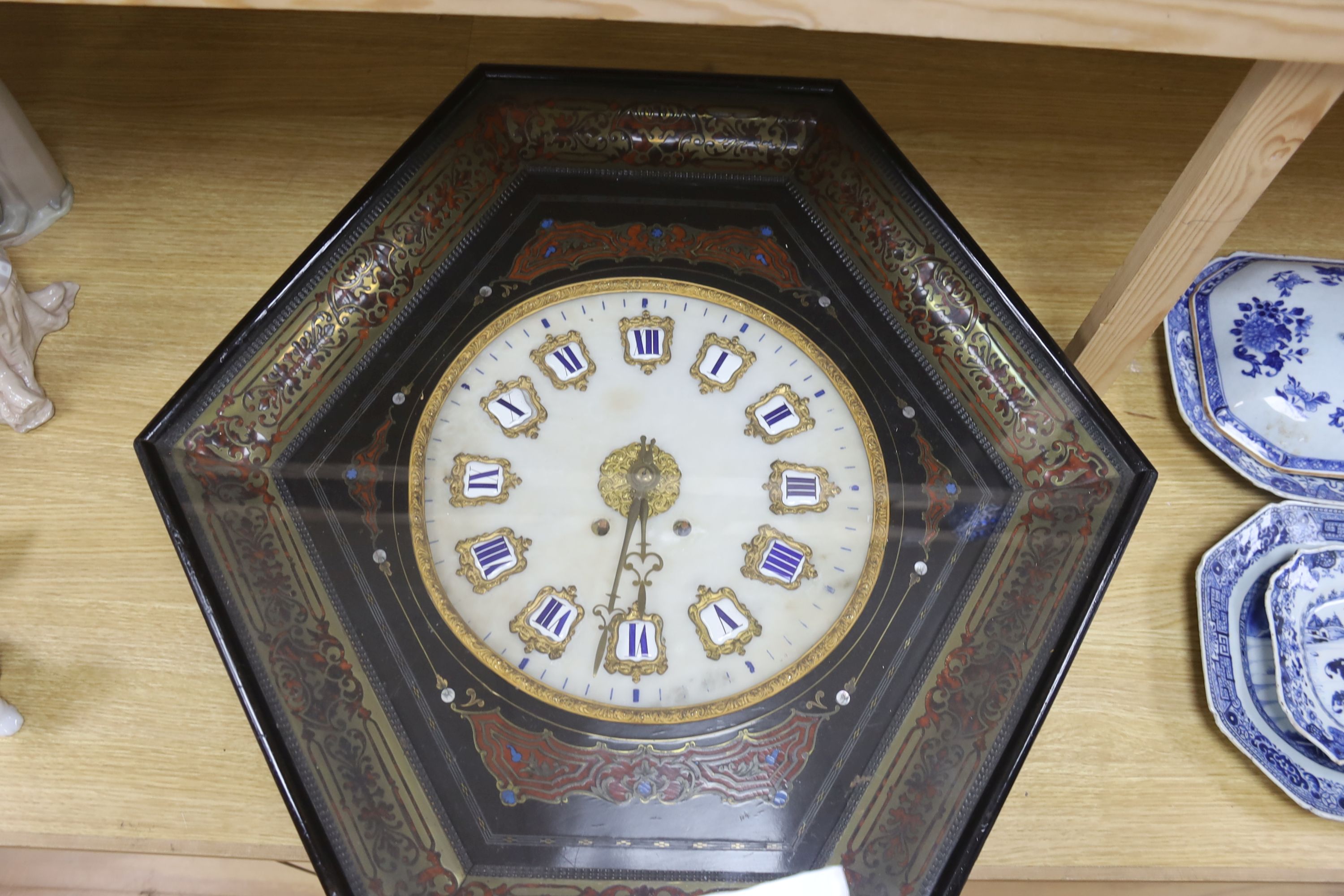 A 19th century French ebonised boulle wall clock, width 68cm length 66cm